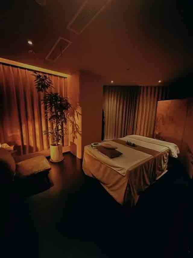 Soft lighting in massage room for deep relaxation